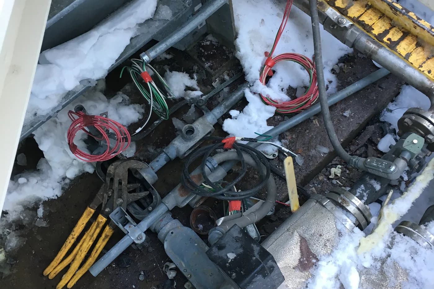 Electrical enclosure opened up in the snow during an after hours repair